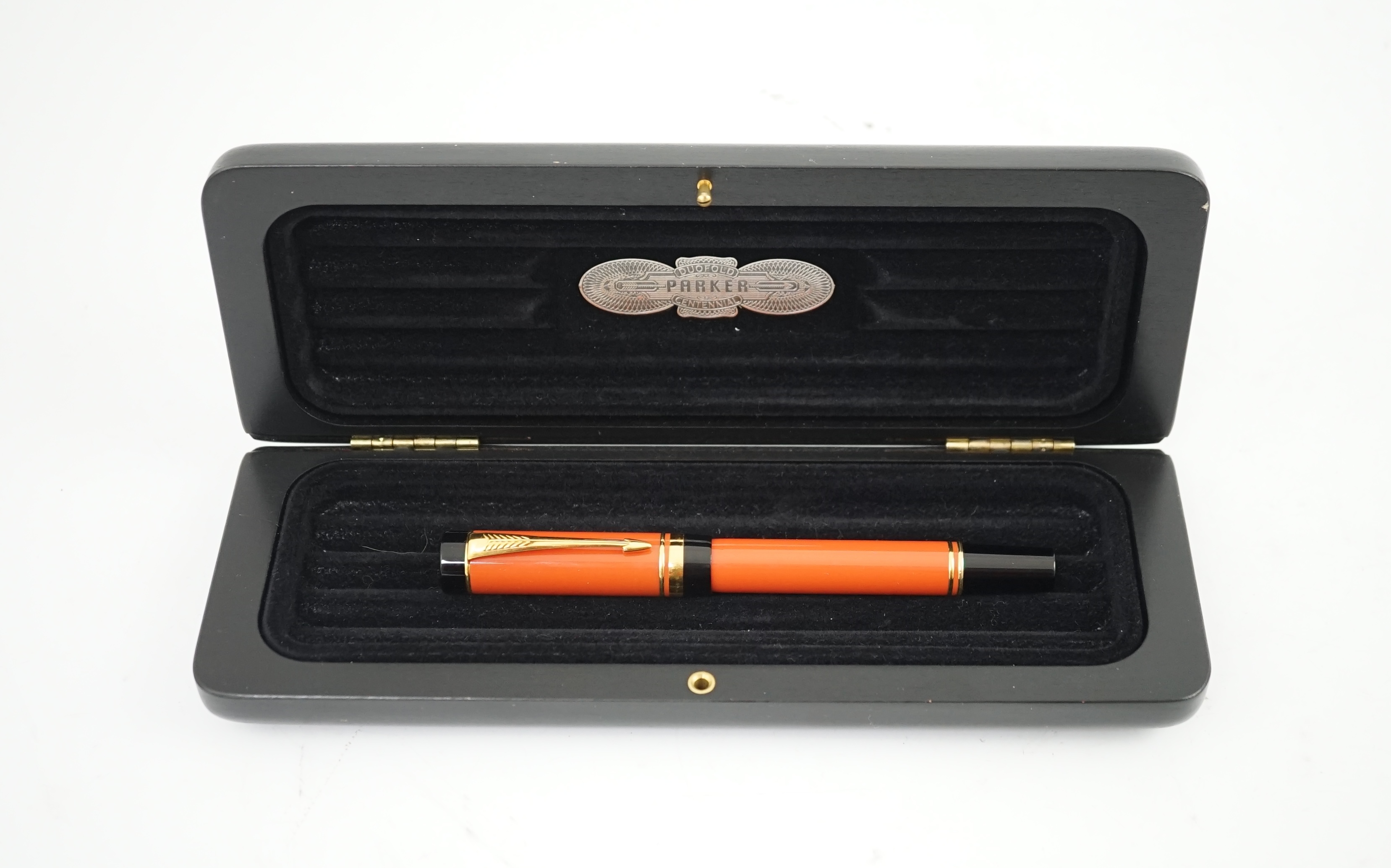 A Parker Duofold orange international fountain pen, in black case